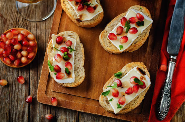 Crispy Crostini with Balsamic Roasted Cranberries and Creamy Brie