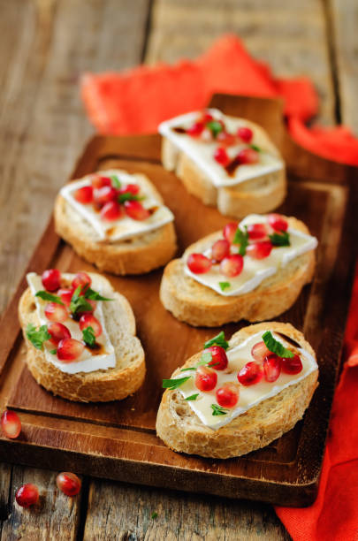 Crispy Crostini with Balsamic Roasted Cranberries and Creamy Brie