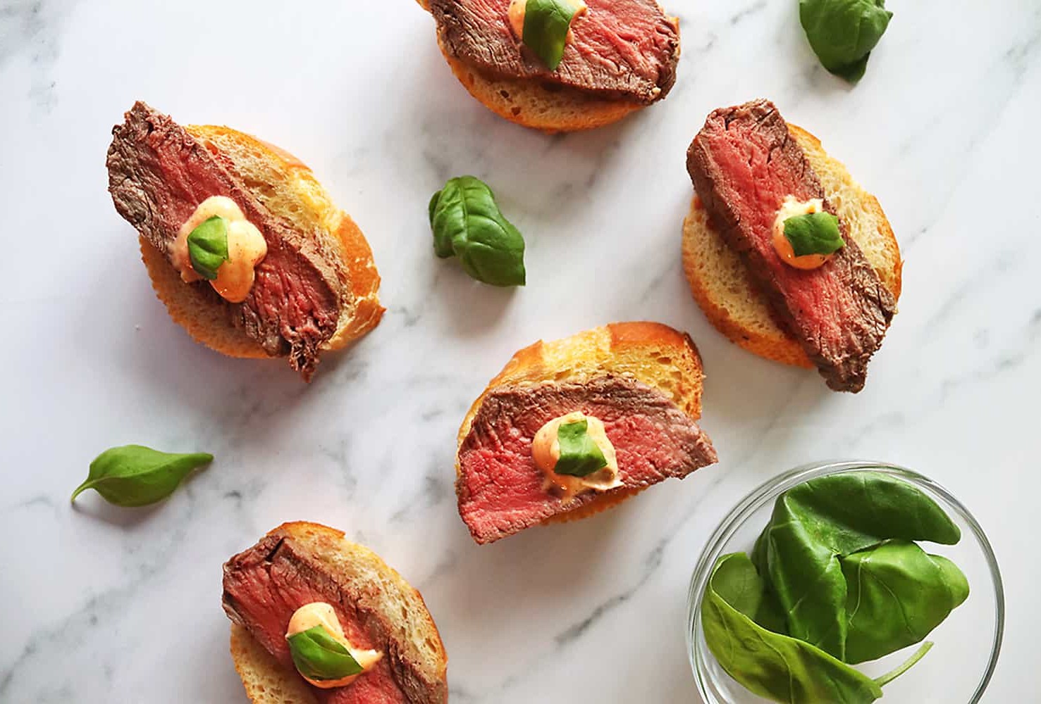 Beef Tenderloin Crostini with Parmesan Cream Sauce