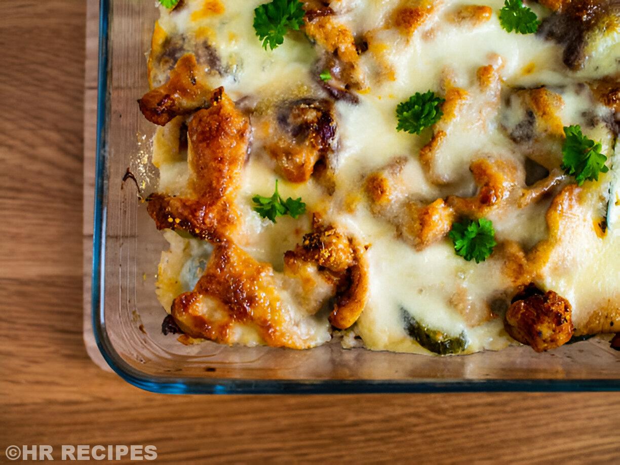 Baked dish with melted cheese and garnished with fresh parsley