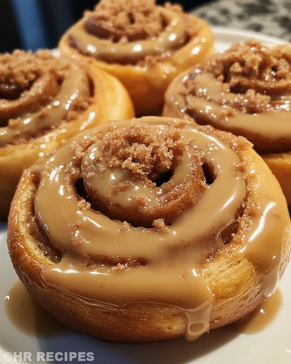 Close-up of Biscoff Cookie Butter Cinnamon Rolls in pressure cooker with steam cues