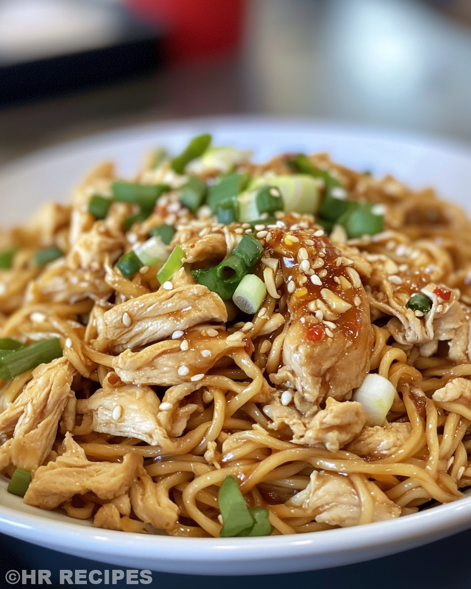Served chicken chow mein with noodles and veggies on plate