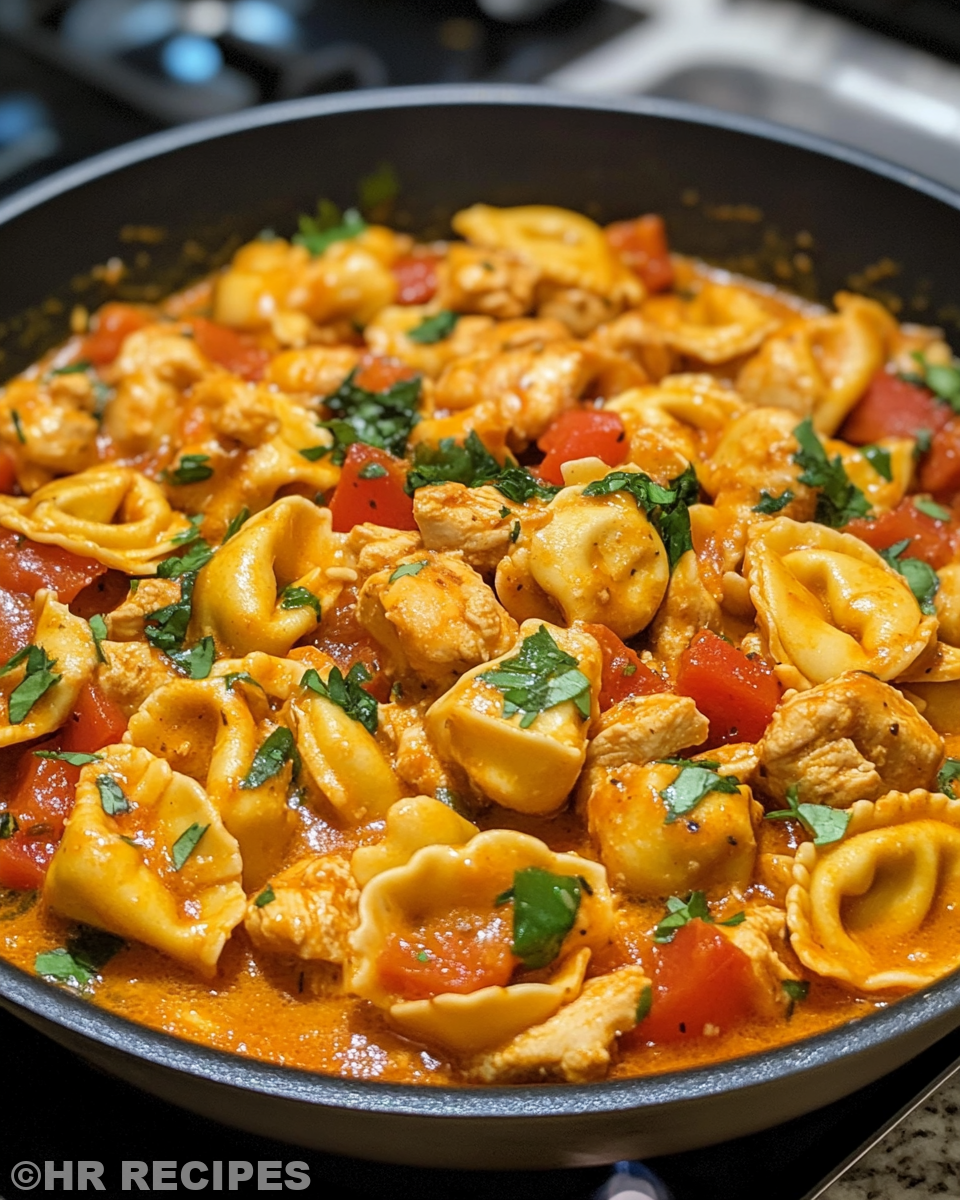 Cooking shallot and garlic for creamy chicken tortellini sauce
